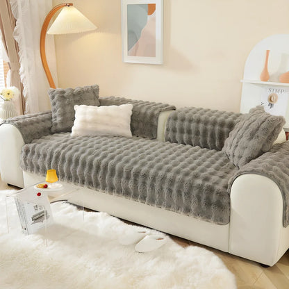 Square flannelette sofa cushion in light blue colour measuring 110x160cm on grey fabric sofa