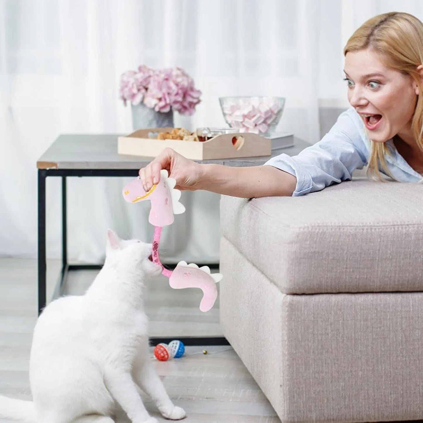 Set of four colourful plush cat toys: a fish, a mouse, a bunny, and a knotted rope, on a neutral background.
