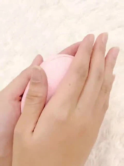 Compact, pebble-shaped hand warmer with adjustable heating settings, available in multiple colors