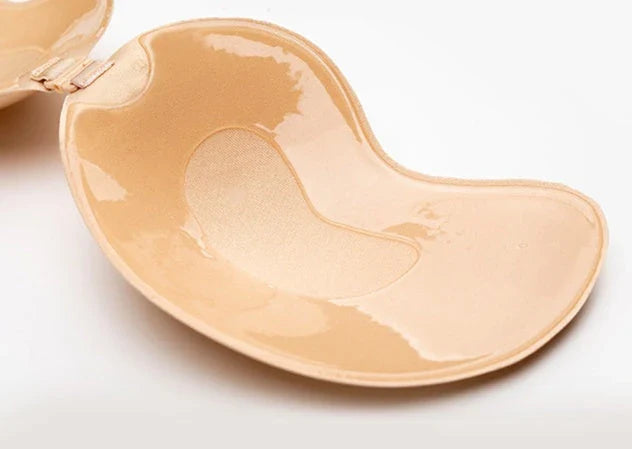 A discreet, backless and strapless silicone bra that provides a natural lift and invisible support under clothing.