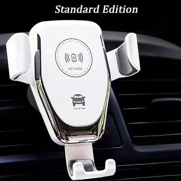 Black car phone mount with automatic clamp holding an iPhone on a car air vent, charging wirelessly.