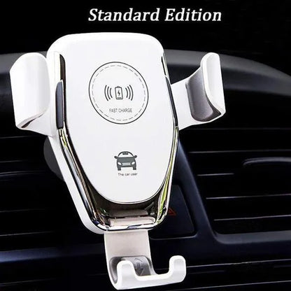 Black car phone mount with automatic clamp holding an iPhone on a car air vent, charging wirelessly.