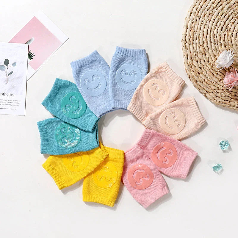 Cozy knee pads in various colors designed to protect babies during crawling with a non-slip, stretchy fit
