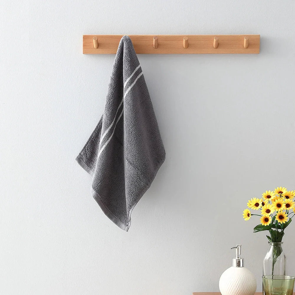 Blue smart sensor cotton towel measuring 34cm by 74cm with 100% cotton composition