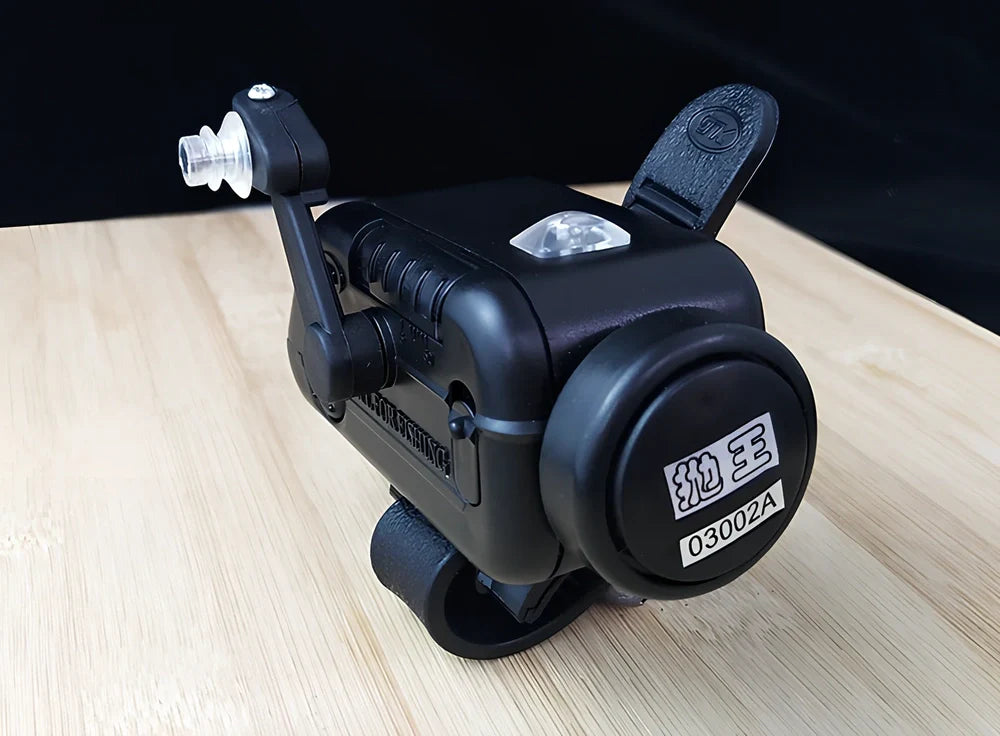 Black sea fishing bite alarm with ABS shell and polymer mounting belt for rod attachment