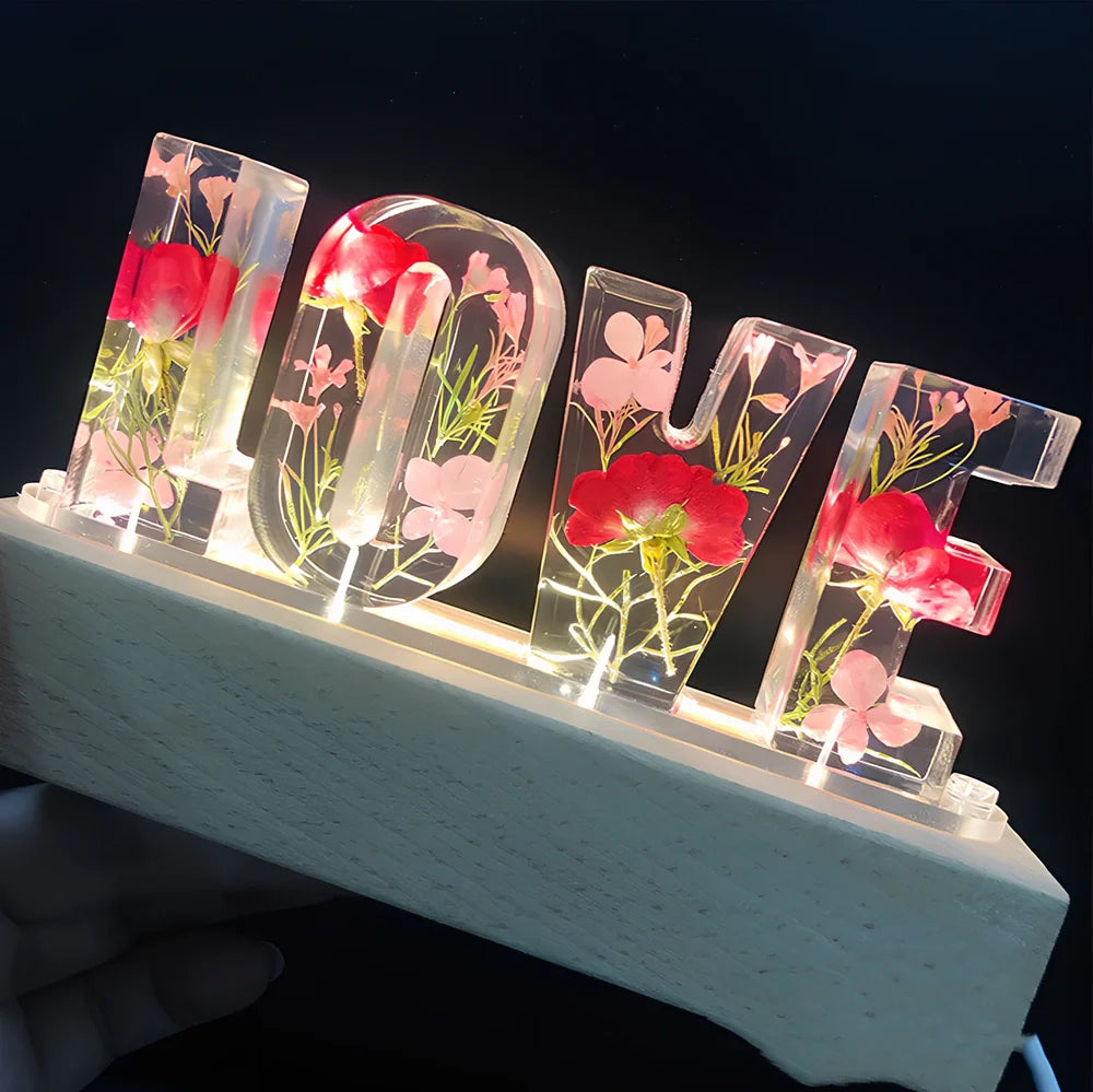 Wooden LOVE letter table lamp with dried flowers and warm LED light for bedroom use