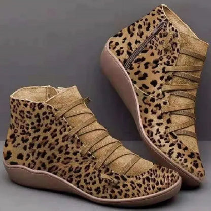 Women's casual booties with wedge heel and round toe in various colours like black and leopard print, showing rubber sole.