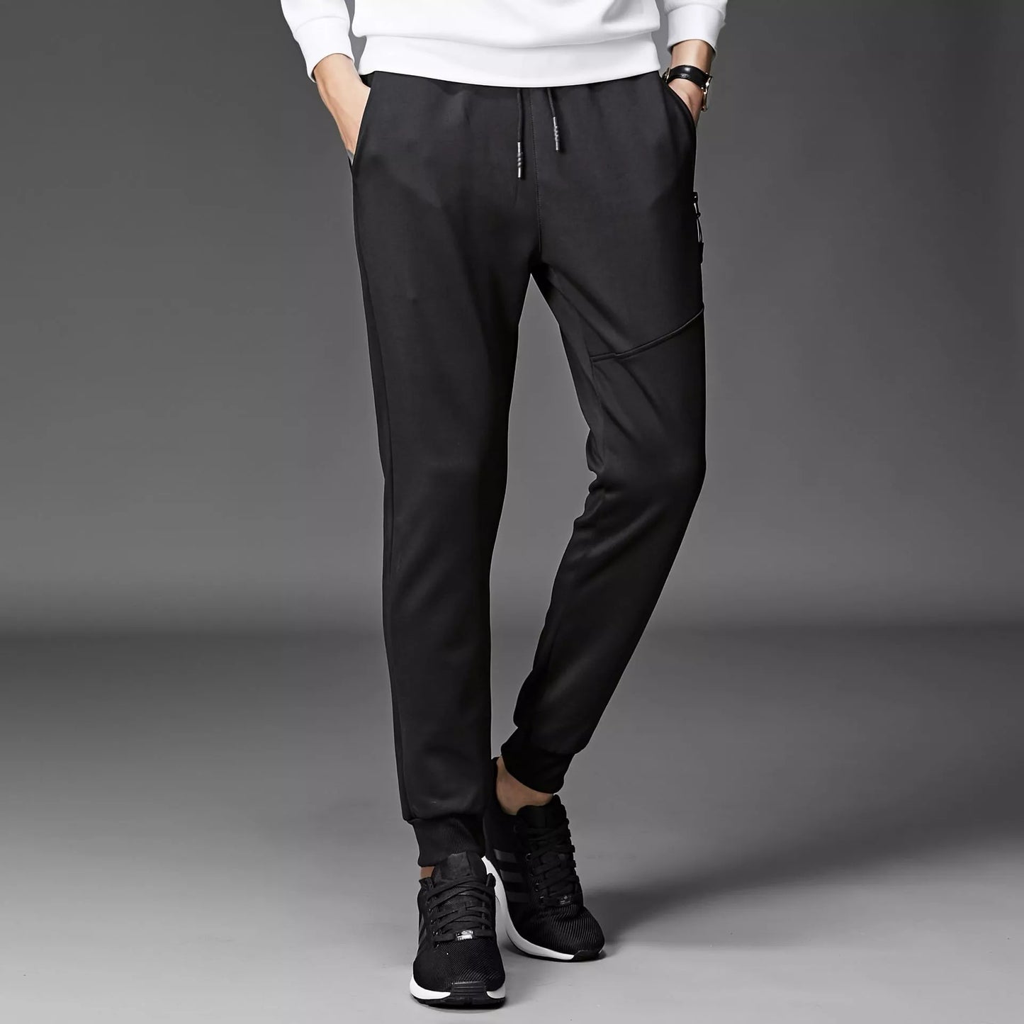 Men's winter sports pants in black and grey, made with South Korean silk fabric for warmth and flexibility