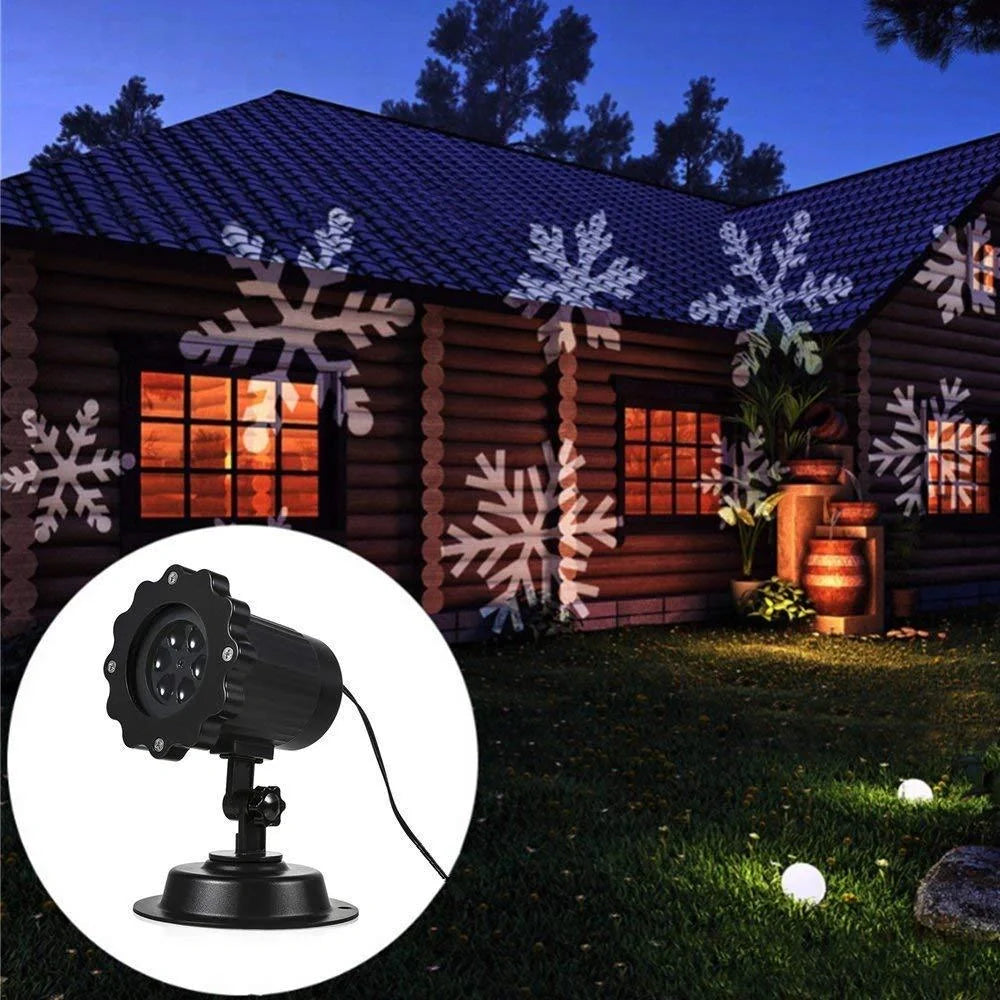 LED Christmas Snowflake Laser Projector casting white snowflakes on a wall