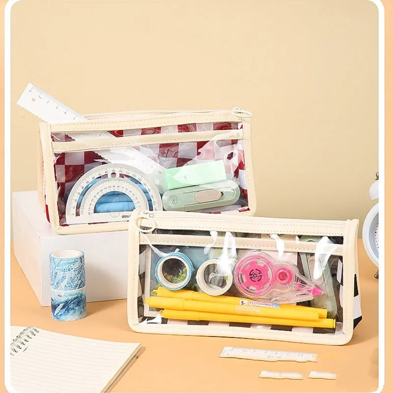 Chessboard pattern transparent PVC pencil case showing 21.5cm length with stationery items visible inside