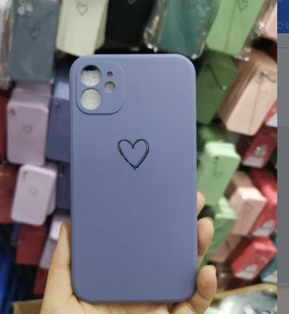 Silicone iPhone case in solid colours like black, green, pink, and white, showing TPU material and slim back cover design