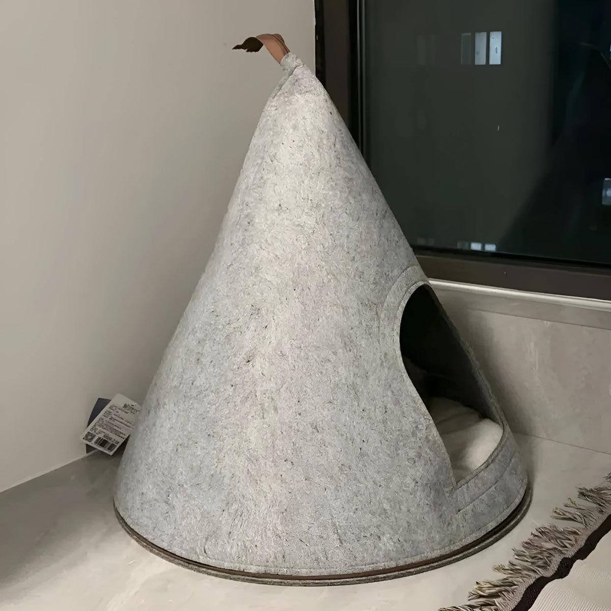 Grey felt cone-shaped cat house with tent design for indoor pets