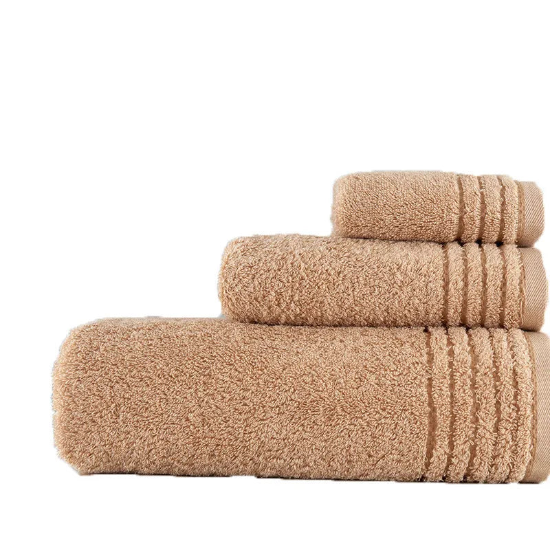 Beige and brown cotton towel set showing bath, hand, and face towel sizes.