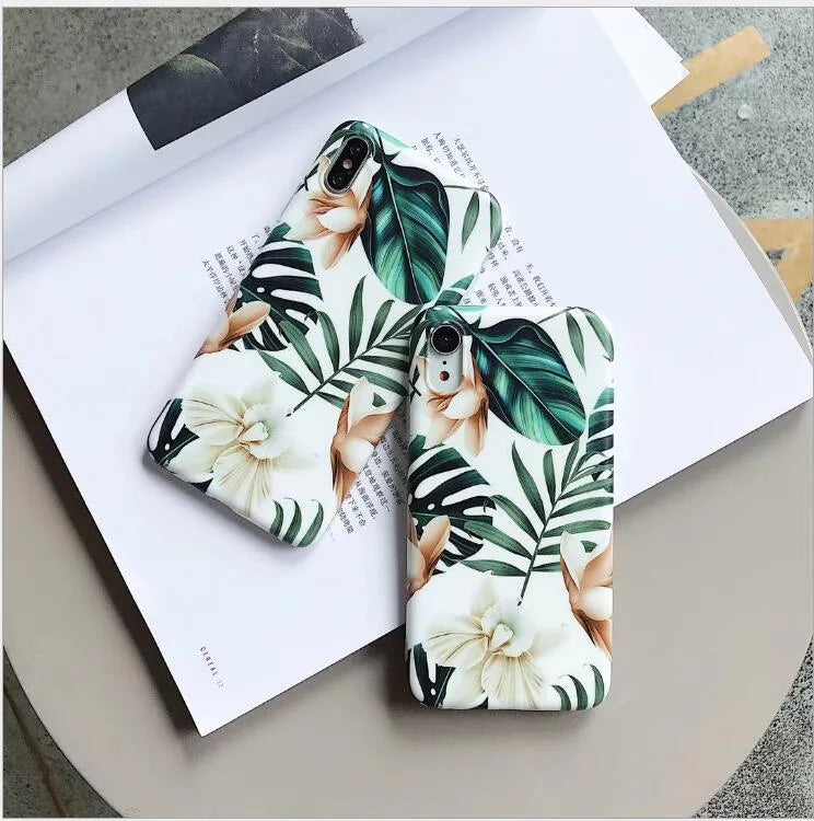 Retro floral iPhone case with banana leaf and flowers design in leaves colour on a soft TPU back cover.
