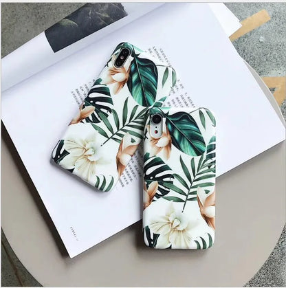 Retro floral iPhone case with banana leaf and flowers design in leaves colour on a soft TPU back cover.