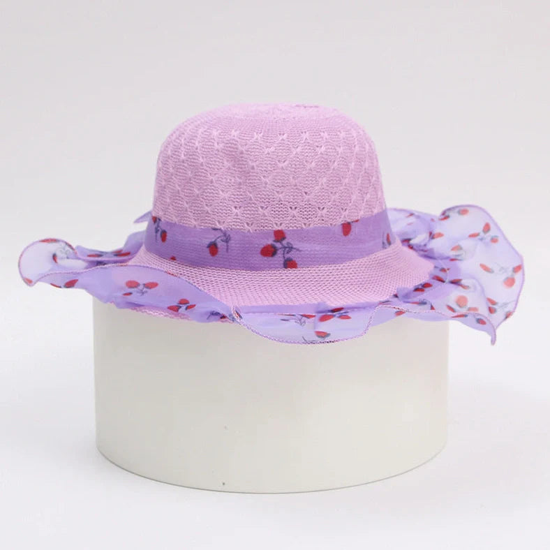 Children's princess straw hat with floral accents and wide brim for sun protection
