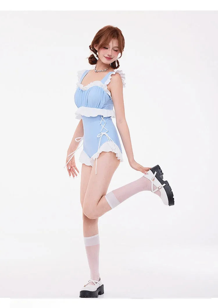 Light blue women's one-piece swimsuit with lace trim on chest, high-waisted and backless.