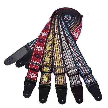 Adjustable embroidered guitar strap with durable webbing and intricate design