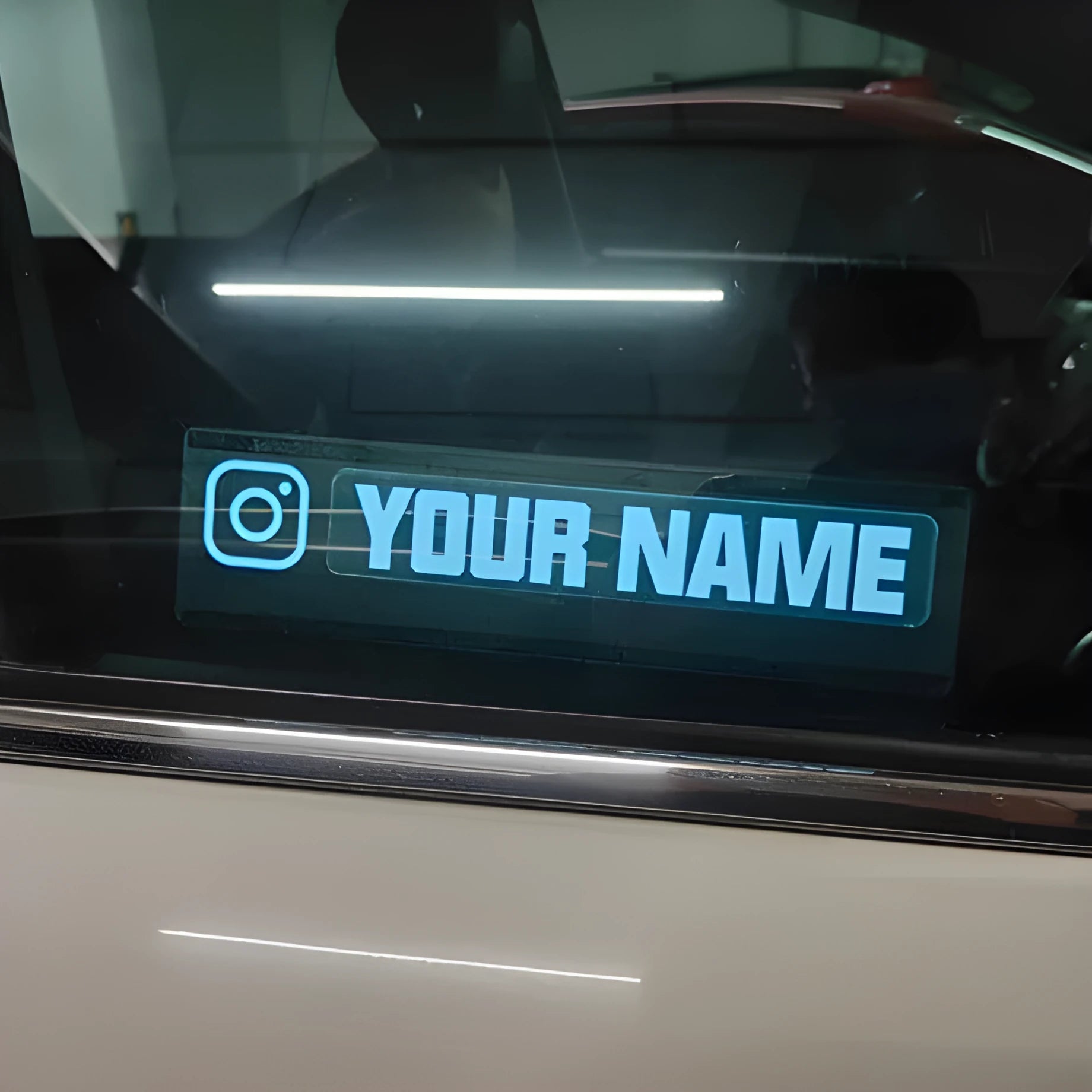 Thin 0.5mm electroluminescent car window sticker kit with driver unit and cable producing white light.