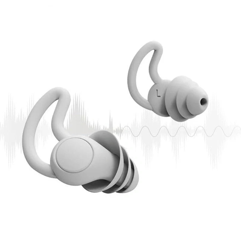 Silicone anti-noise sleep earplugs in grey and black, featuring shark fin design for secure fit