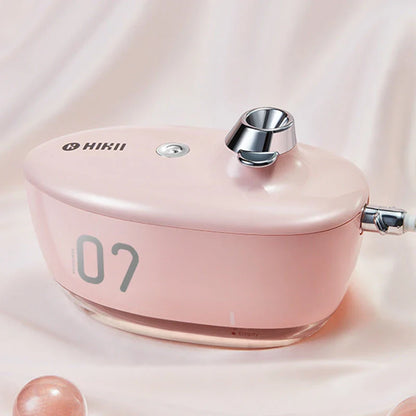 Compact, USB-powered portable air humidifier with discreet night light and silent operation for improved air quality and comfort