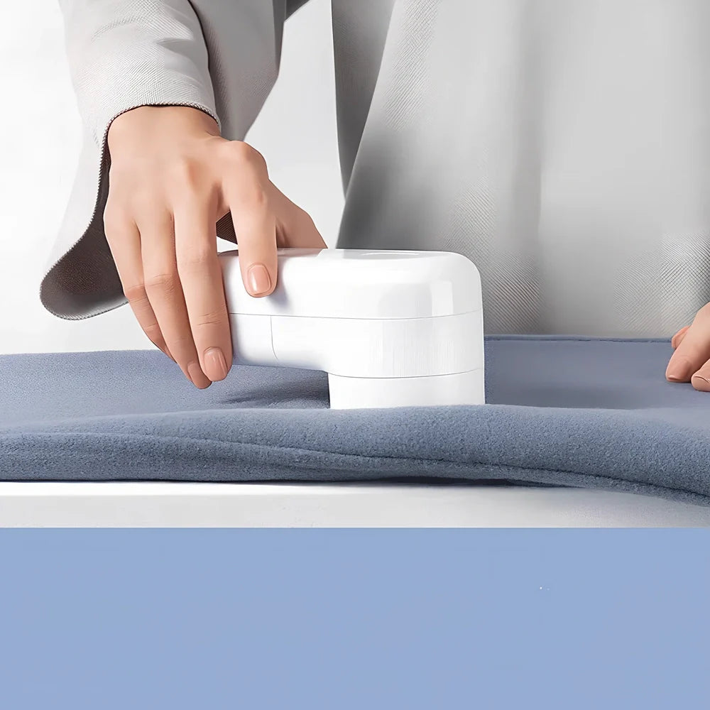 White plastic electric shaver with bulb removal function measuring 145mm length