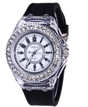Women's LED luminous quartz watch with silicone strap and round alloy case on wrist