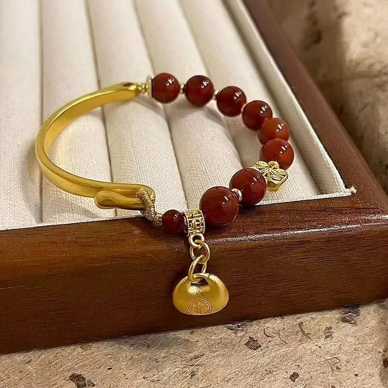 Golden antique-style Southern Red Agate Character Ingot half bracelet for women with lucky bag design.