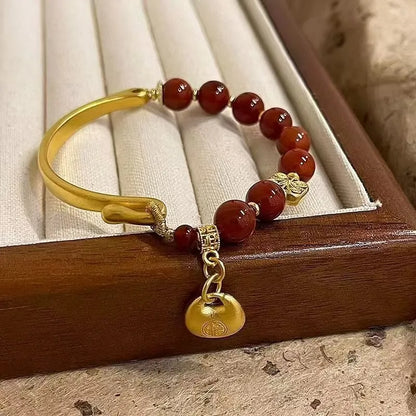 Golden antique-style Southern Red Agate Character Ingot half bracelet for women with lucky bag design.