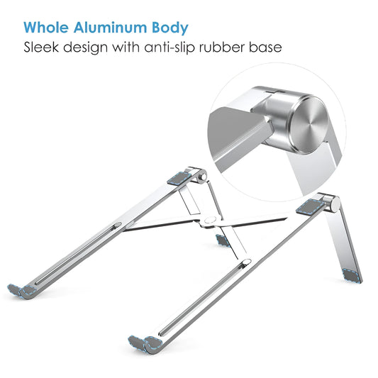 Black and silver aluminum laptop stand measuring 26cm wide on a wooden desk.