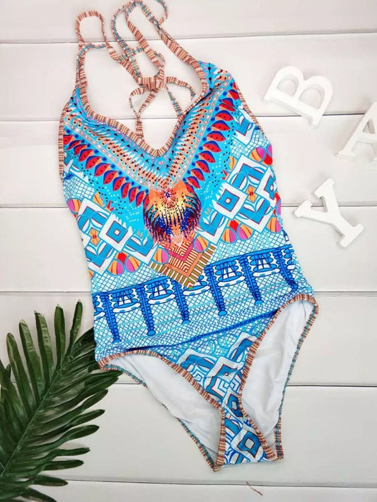 Women's printed one-piece swimwear with vibrant design and stretch material