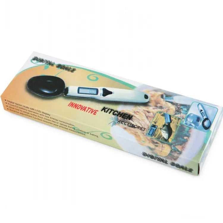 Smart digital measuring spoon with electronic display showing weight, alongside two AAA batteries.