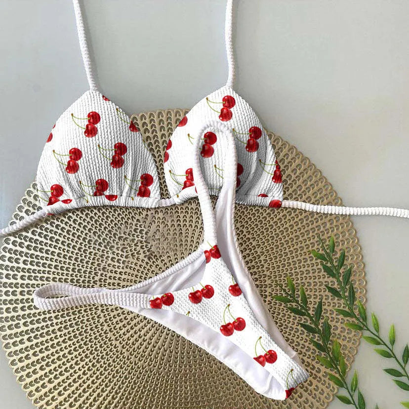 Women's printed bikini swimsuit with briefs style and cotton lining on a mannequin.