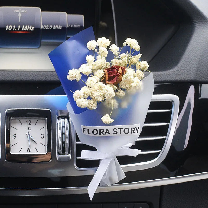 Mini dried flower bouquet mounted in car air vent for decorative aromatherapy