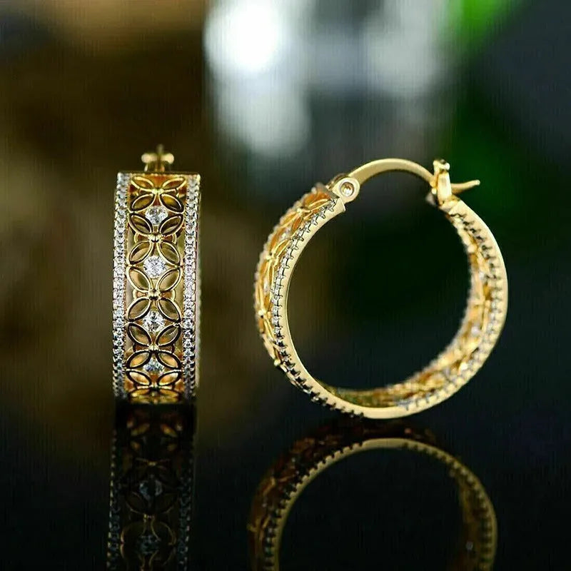 Golden copper ear clip jewellery featuring a geometric horse eye design with flower and butterfly details.