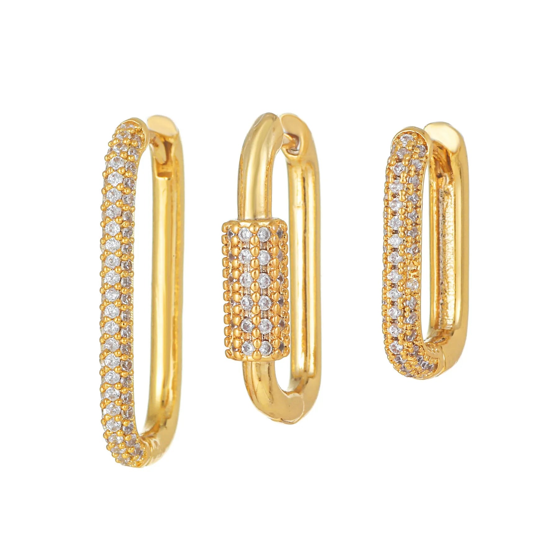 Three geometric copper ear clips with micro inlaid zircon in gold and white tones on a grey background.