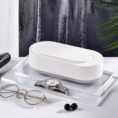 White portable ultrasonic cleaner with stainless steel tank for cleaning jewellery and glasses