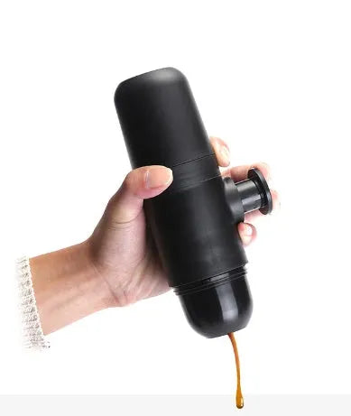 Black portable manual coffee machine with pressure gauge, 6cm wide and 17.5cm tall.