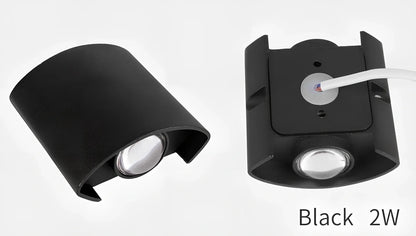 Waterproof black aluminium LED wall lamp 4W warm white emitting 60-degree beam angle mounted on white wall