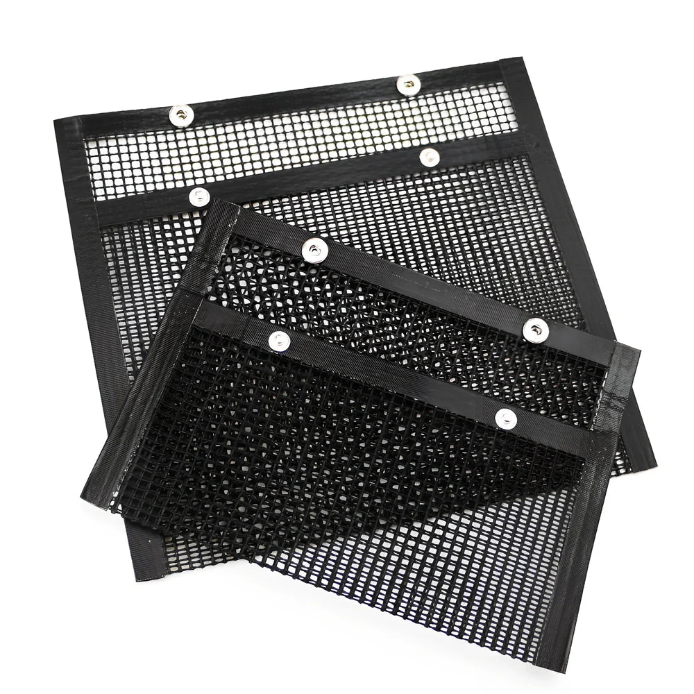 Black grill mesh bag with non-stick grid mat on barbecue, showing smoke circulation through mesh design