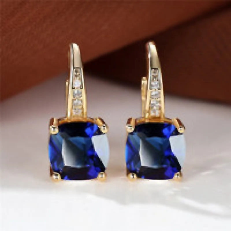 Square geometric ear clips with colourful moissanite inlays and a metallic electroplated finish.