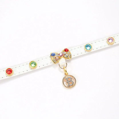 White cat collar with silver diamond alloy bow showing four size options from 26cm to 38cm length