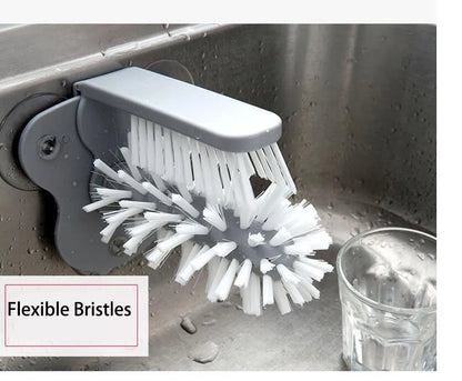 Grey rotating double-head cup brush with suction cups for wall mounting.