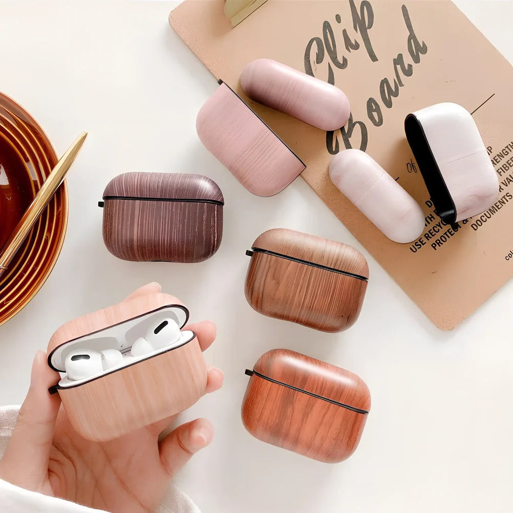 Wood grain AirPods case with IMD clamshell design showing six colour options including dark brown and red brown patterns