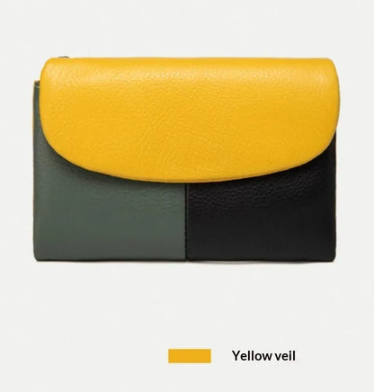 Women's short wallet in soft leather texture with solid colour and stitching detail, urban minimalist style