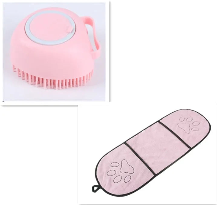 Blue silicone dog bath and massage brush held in a hand.