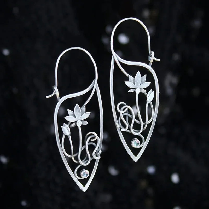 Silver electroplated alloy lotus vine earrings with geometric flower design and round rhinestone details