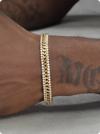 A gold-coloured unisex tennis bracelet with inlaid stones on a titanium steel band.