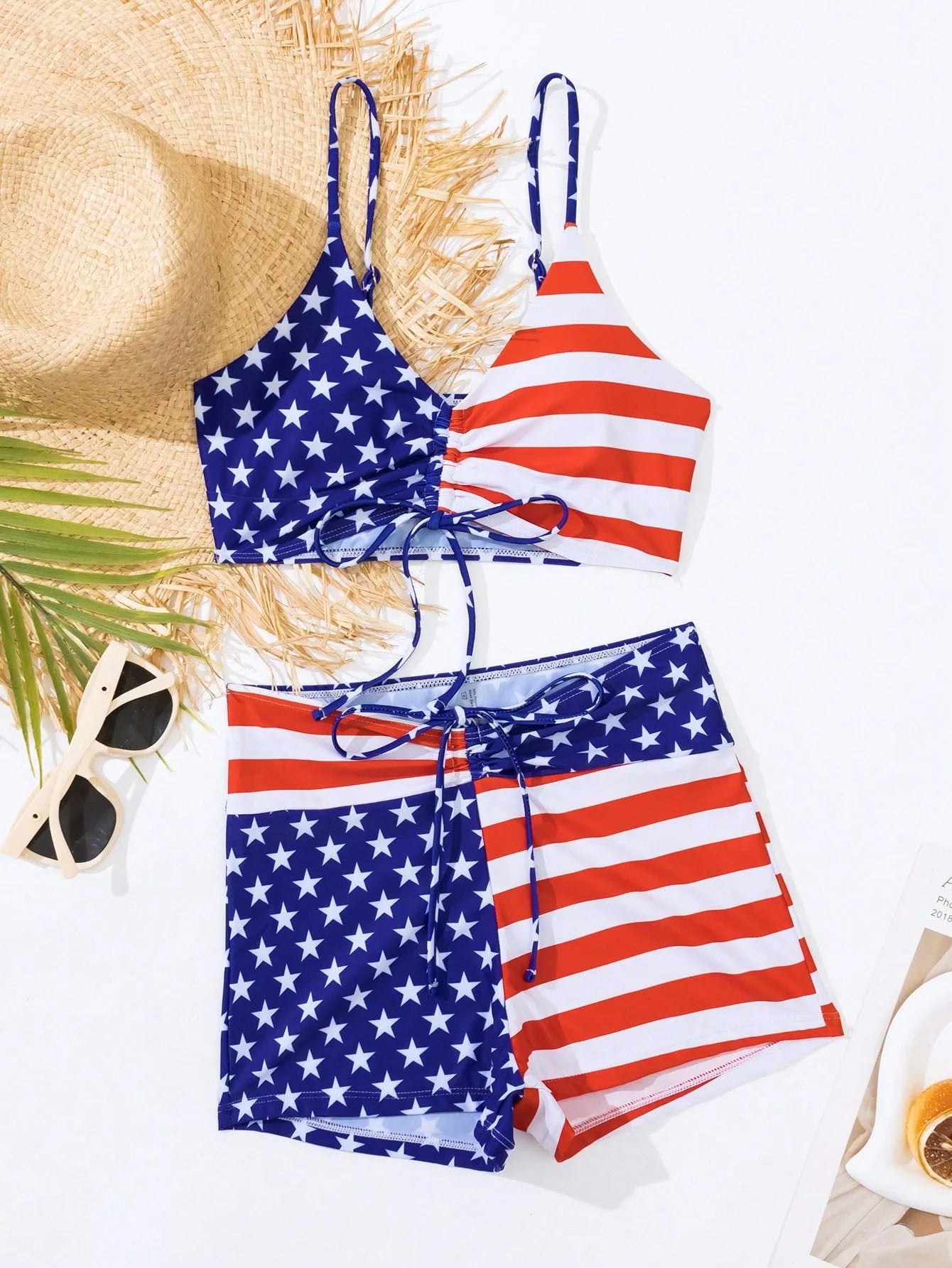 Women's blue and red Stars and Stripes high waist boxer swim shorts with a white drawstring.