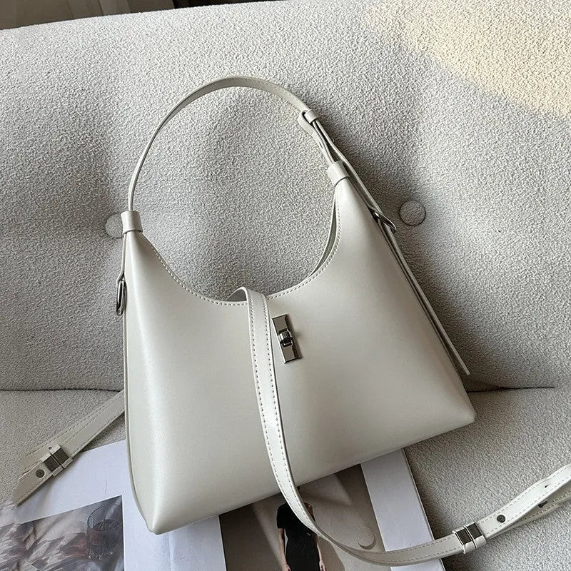 Genuine leather dumpling-shaped crossbody shoulder bag in six colour options showing sandwich pocket and internal organisation